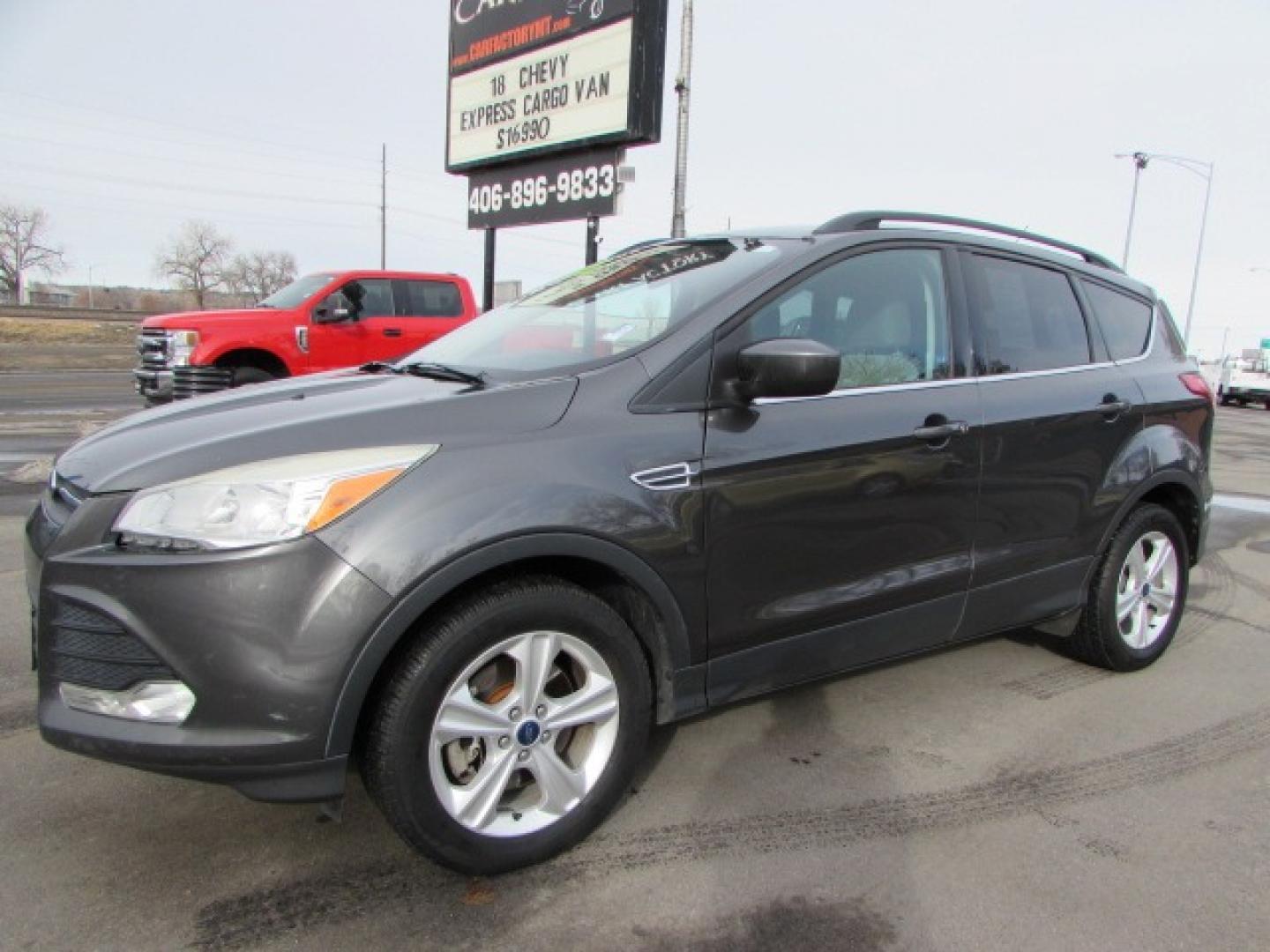 2015 Gray /Tan Ford Escape SE (1FMCU9G96FU) with an 2.0 I4 Ecoboost turbo engine engine, 6 speed automatic transmission, located at 4562 State Avenue, Billings, MT, 59101, (406) 896-9833, 45.769516, -108.526772 - 2015 Ford Escape SE 4WD 2.0 Ecoboost Turbo 4 cylinder engine - 6 speed automatic transmission - 4WD - 151,468 miles $256 per month - payment example based on $1000 cash or trade down - 36 months at 7.99 percent APR - on approved credit SE package - air conditioning - tilt and steering wheel - Photo#0